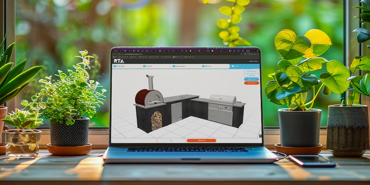 laptop on desk with outdoor kitchen design tool open on screen