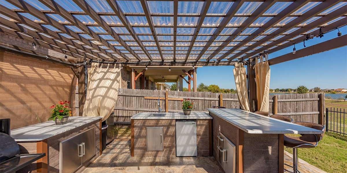 Covered pergola outdoor kitchen with adjustable bar stools