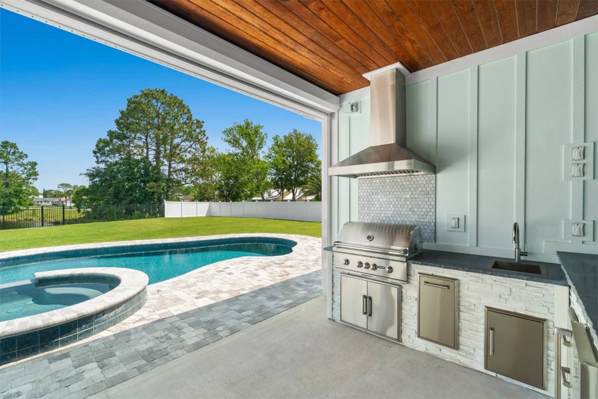 linear island under roof next to pool