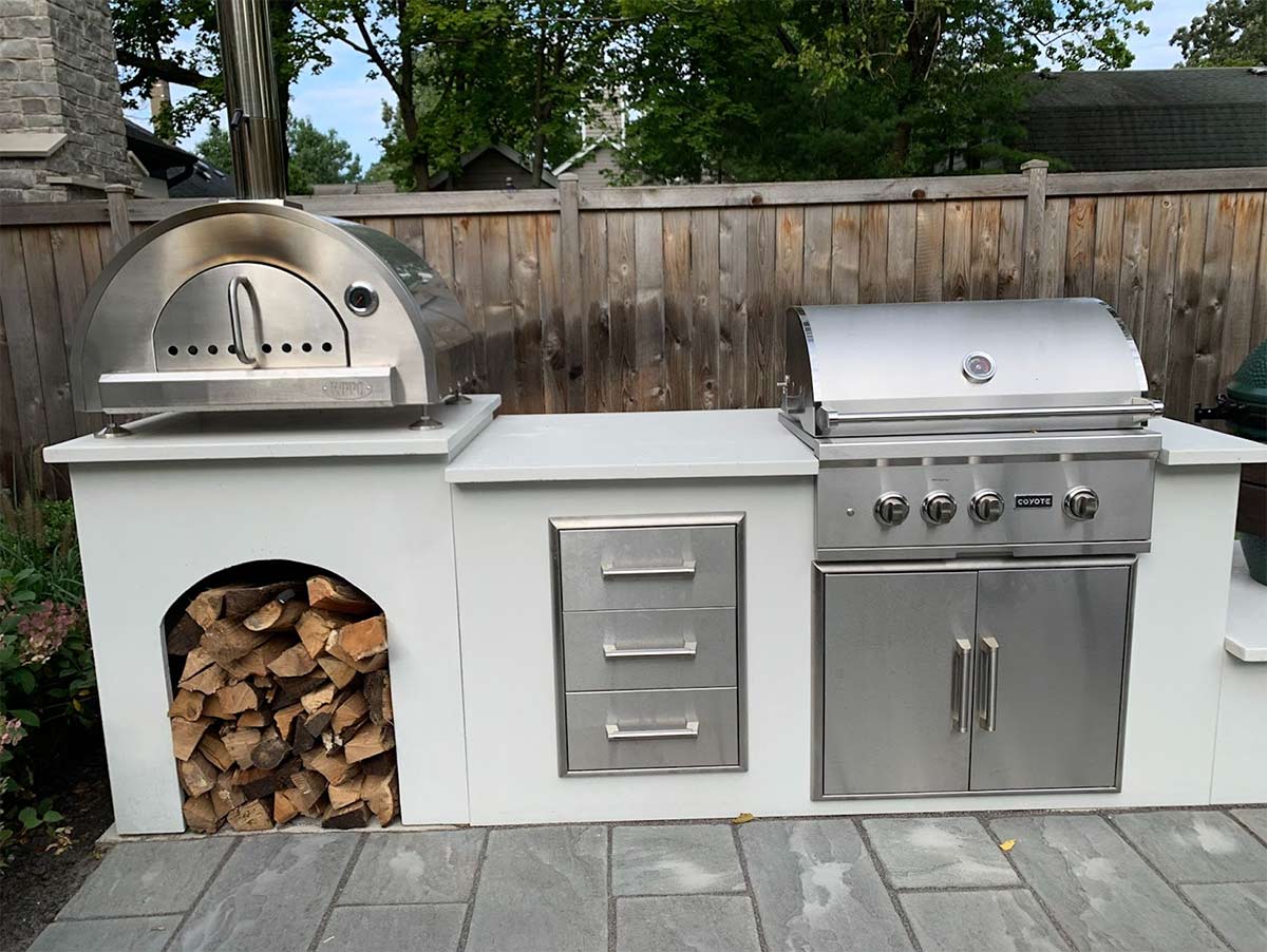 linear moks outdoor kitchen with stainless steel drawers and double access doors