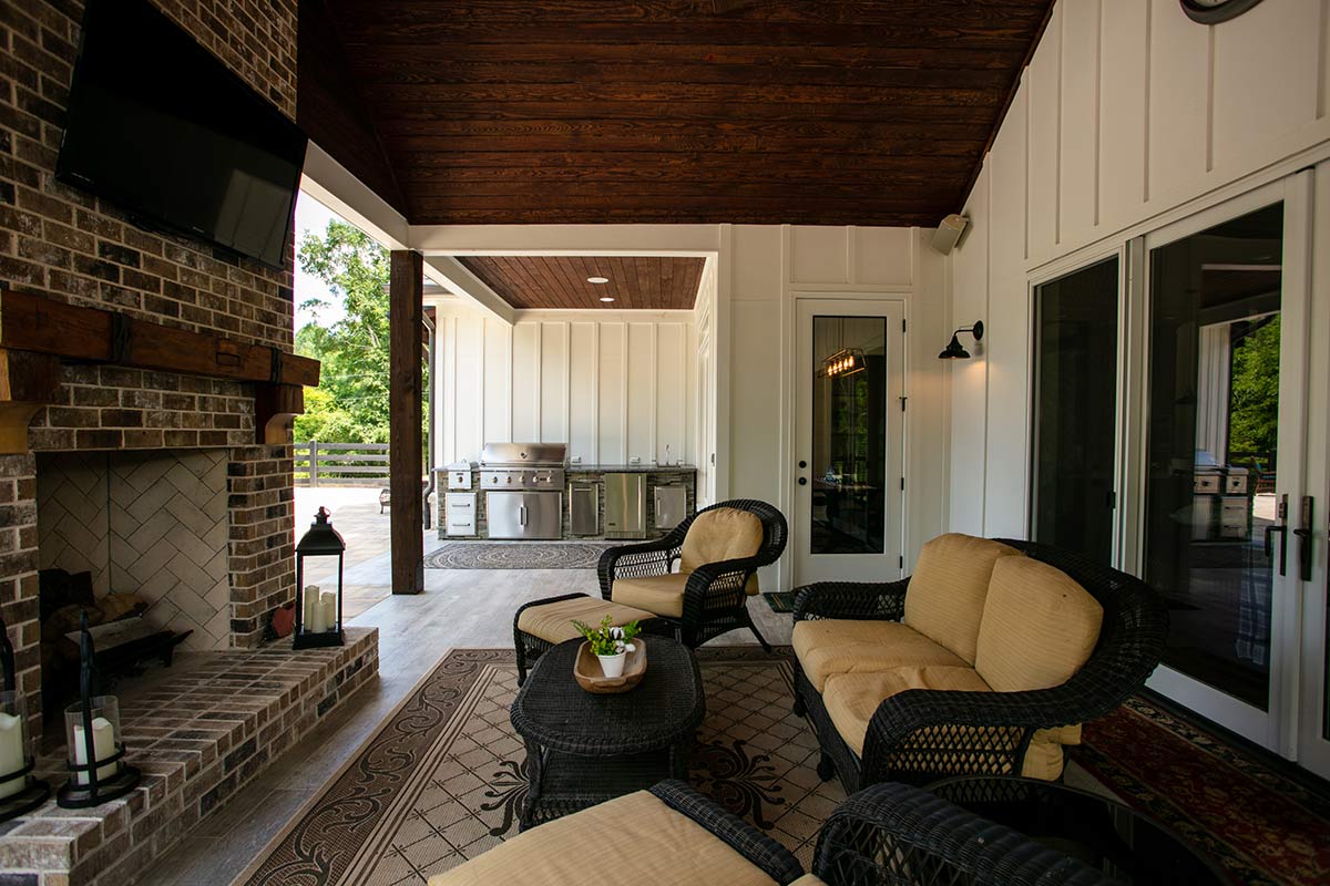 linear outdoor kitchen under a covered patio