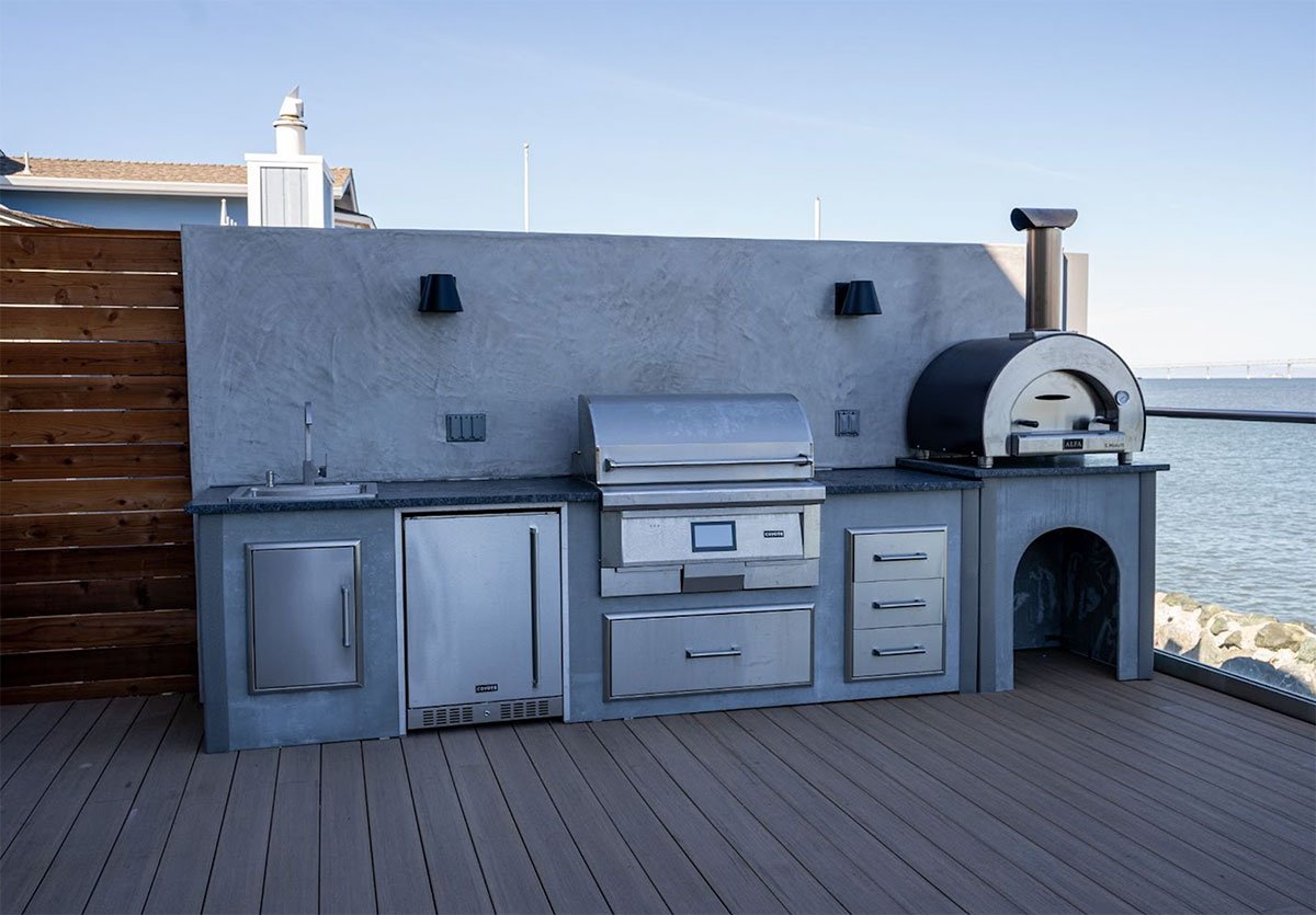 linear outdoor kitchen with concrete backsplash