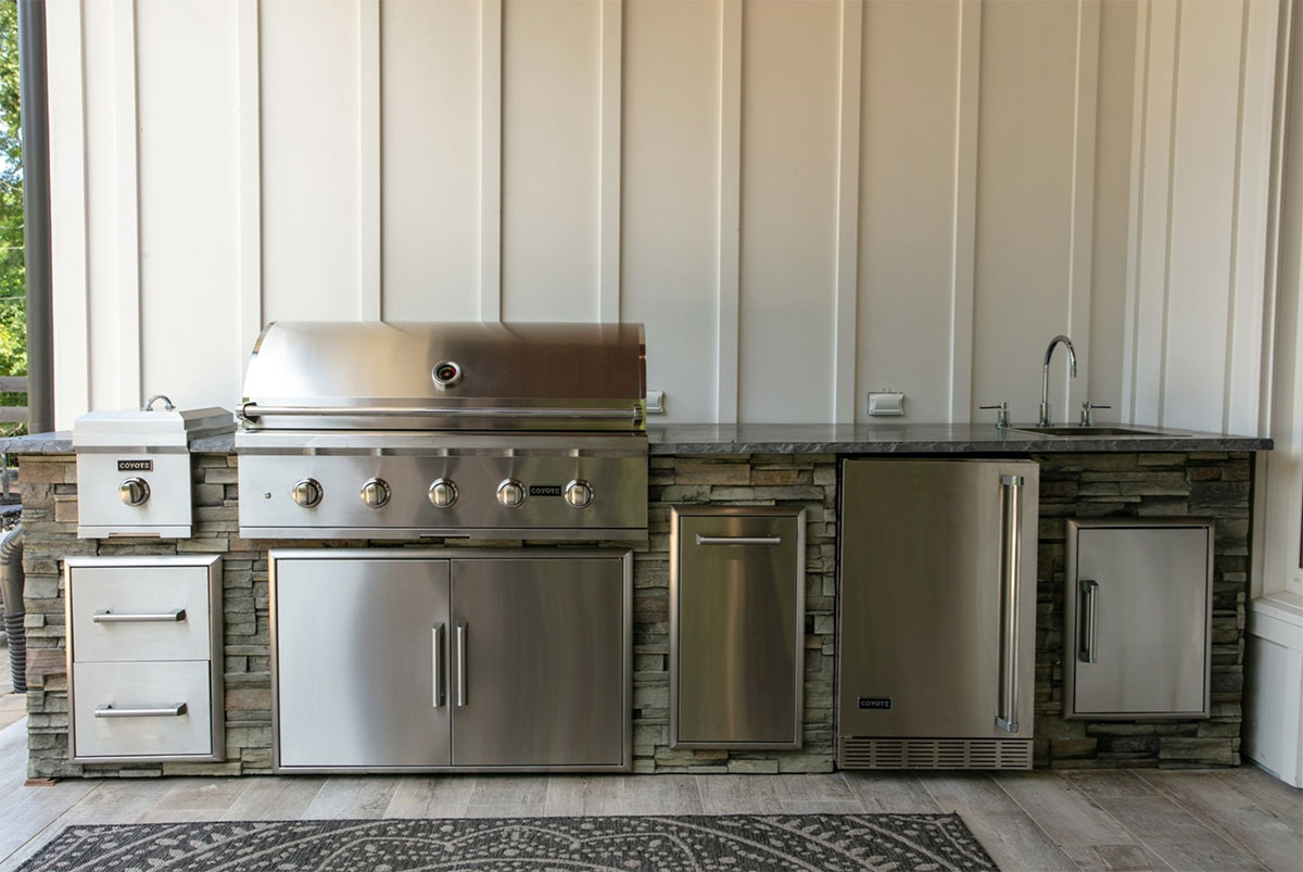 linear outdoor kitchen with mounted wall outlets