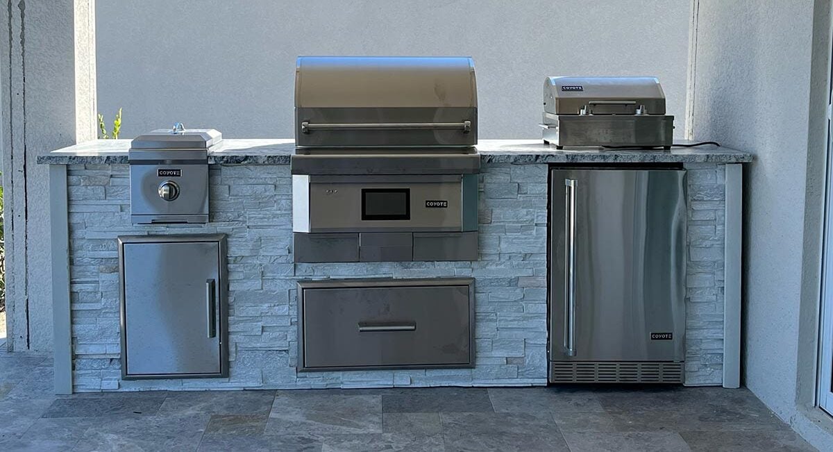 Grills station outdoor with pellet grill and granite countertop