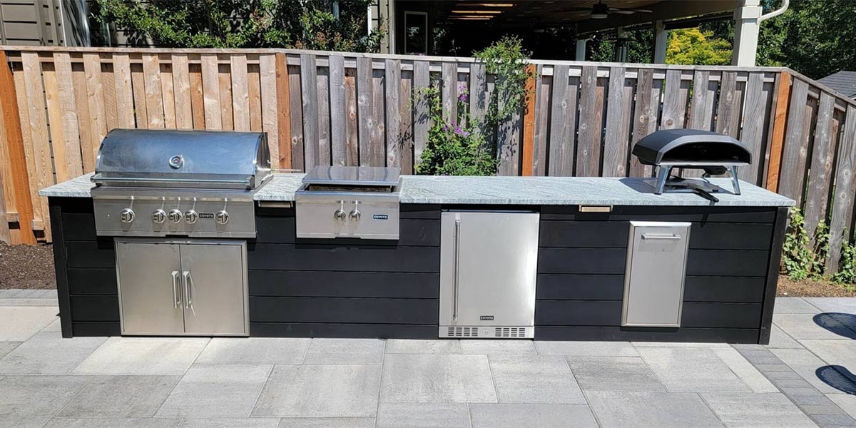 long linear island with black plank style finish on patio