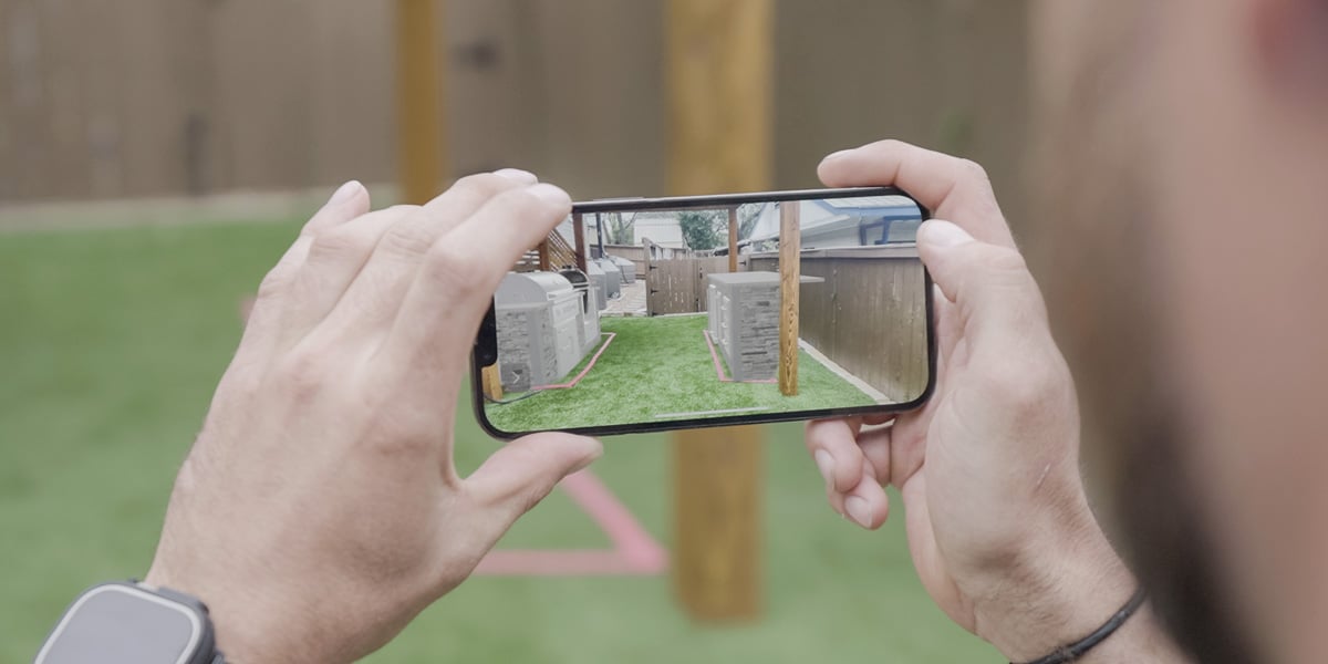 looking at outdoor kitchen through smartphone with augmented reality