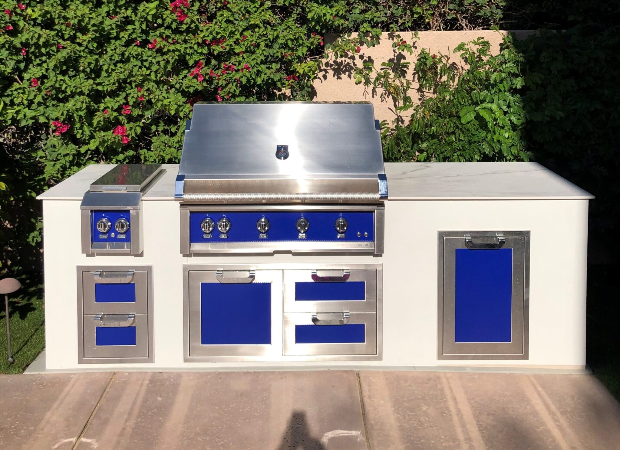 Design and aesthetics of a luxury built in grill in rta outdoor kitchen located on deck of outdoor living space