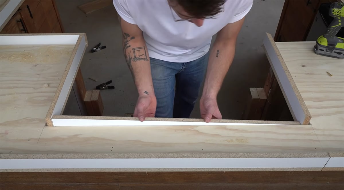 man assembling frame for concrete countertop form