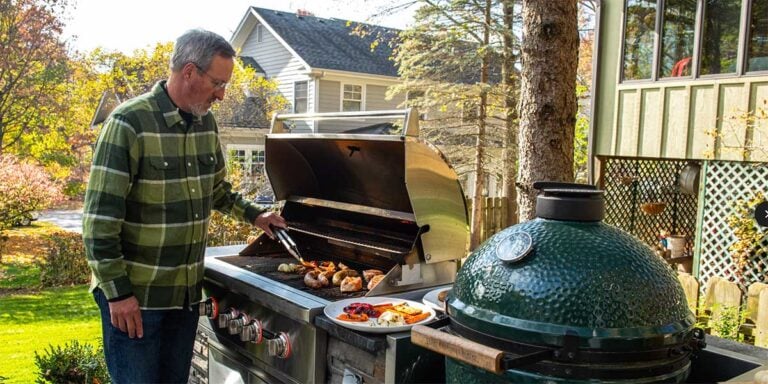 Man grilling at outdoor bbq kitchen