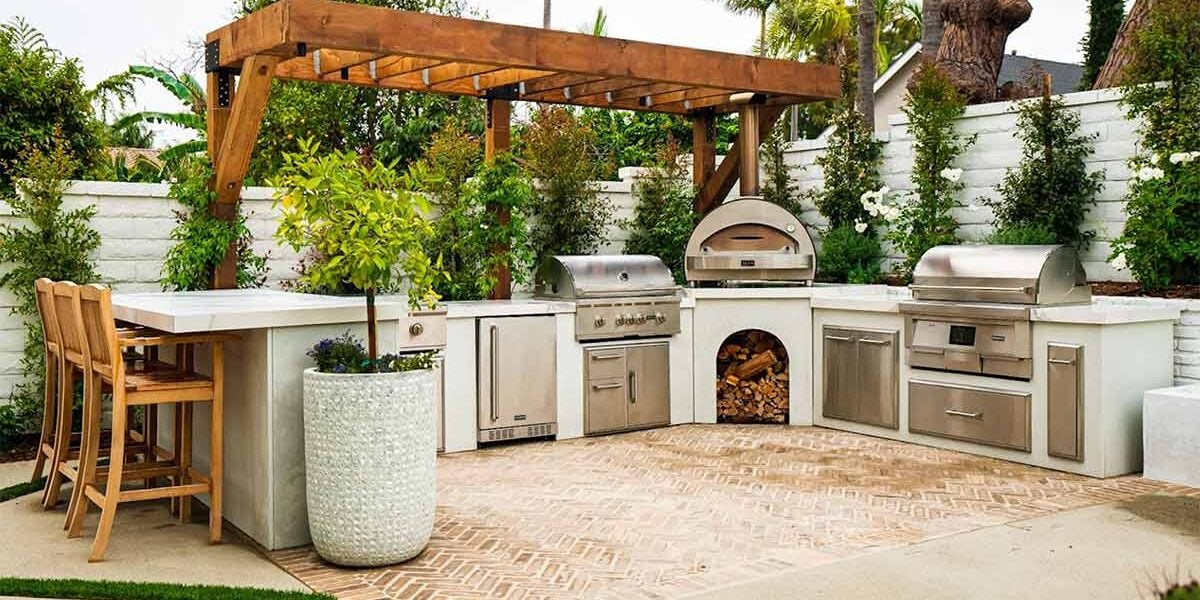 mike pyle modern large u shaped luxury outdoor kitchen & bar in his outdoor space