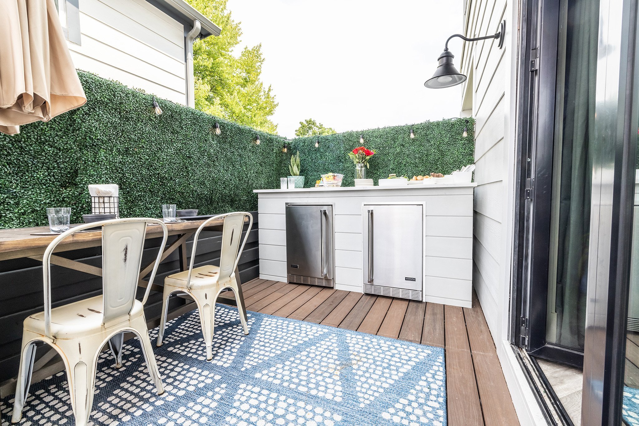 mina starsiaks outdoor kitchen with bar and pizza oven island