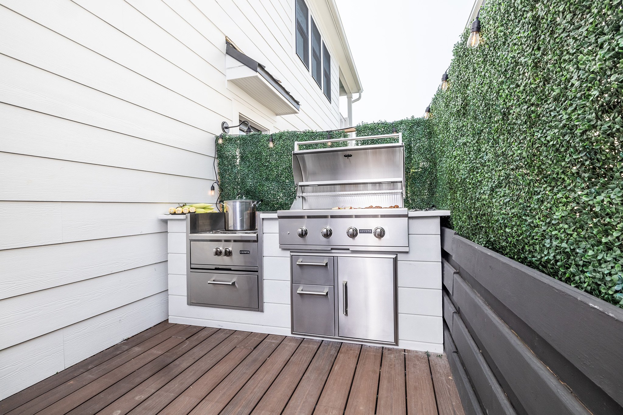 mina starsiaks outdoor kitchen with bar and pizza oven island