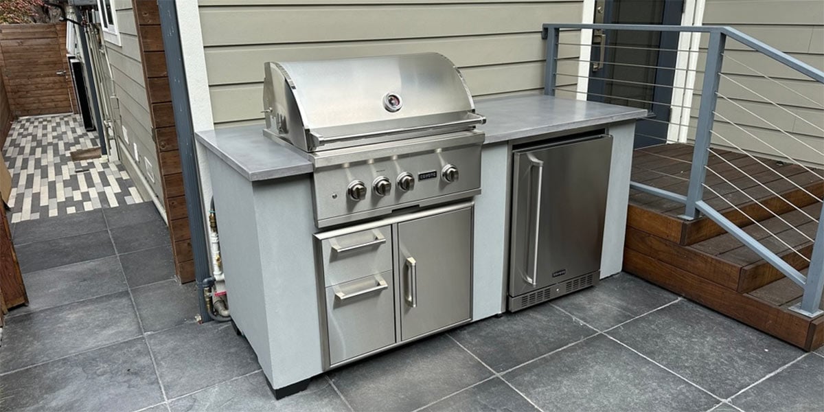 modern concrete industrial grill island on patio
