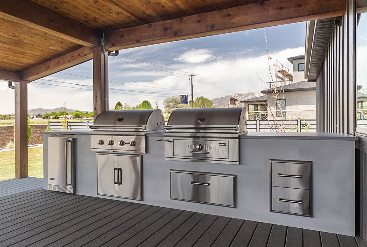 modern concrete outdoor kitchens with gas grill and charcoal grill built in