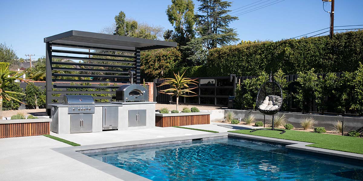 back patio idea with pool and outdoor kitchen