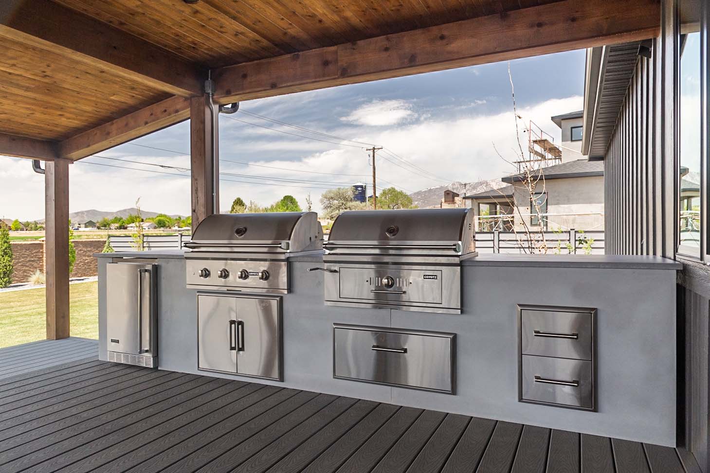 modern concrete white rta outdoor kitchen with 2 grills