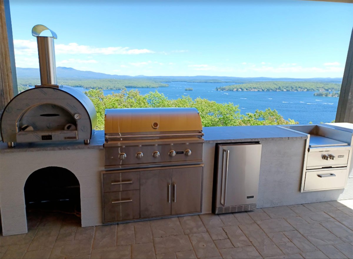 modern industrial outdoor kitchen with lake view
