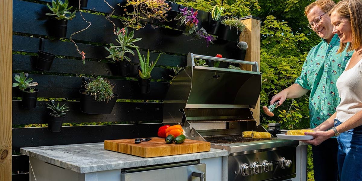 modern succulent garden behind outdoor kitchen