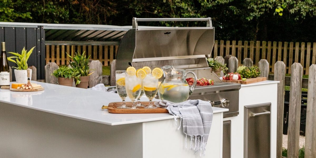 RTA White MOKS in a backyard space with food cooking on the grill