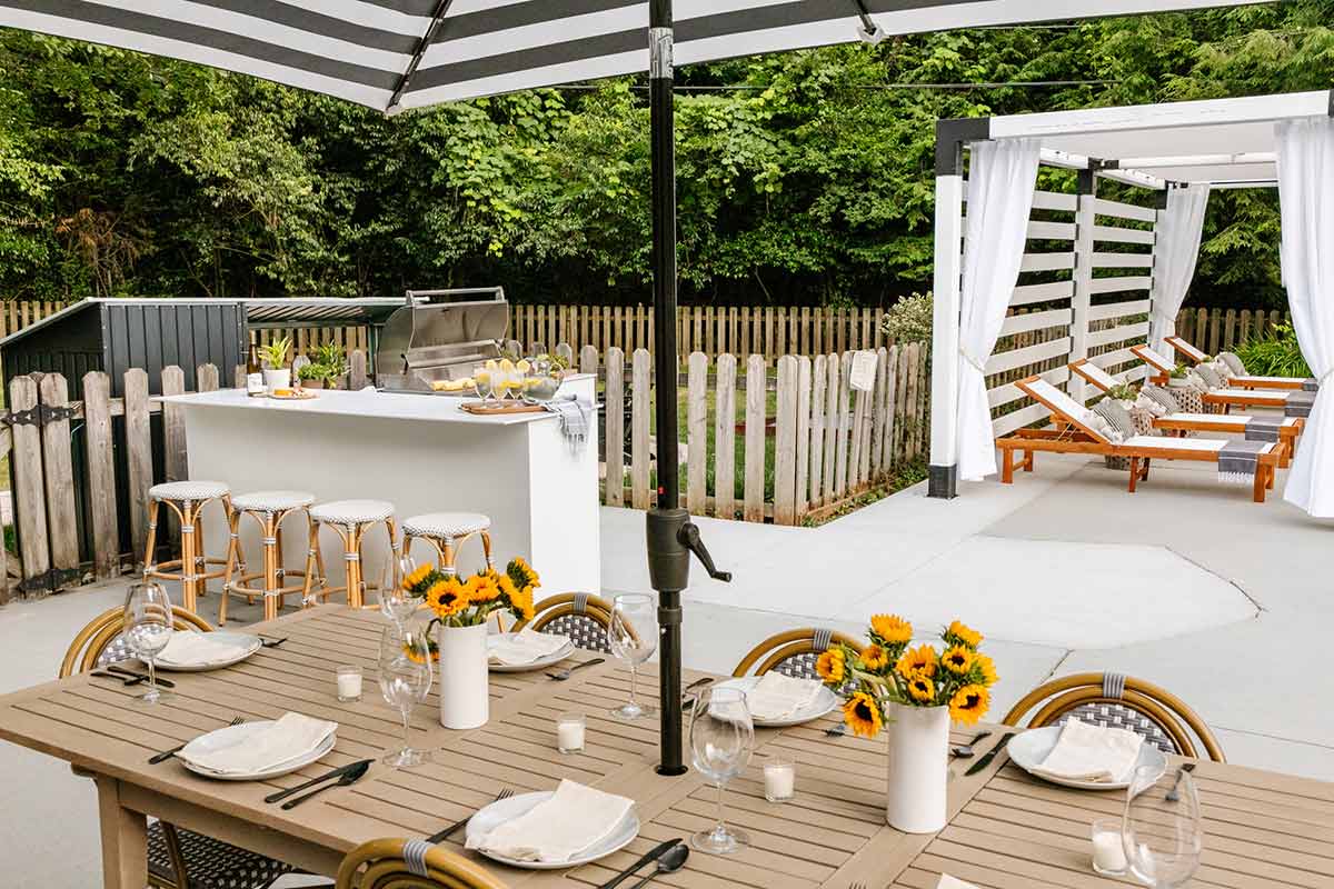 moks outdoor kitchen with bar and stools on patio