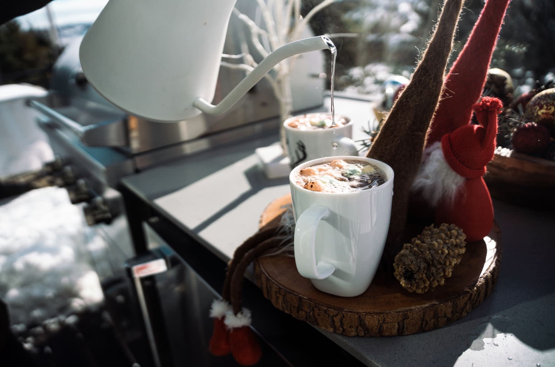 Closeup of Pouring Tea in a Cold Climate in an Outdoor Cooking Space
