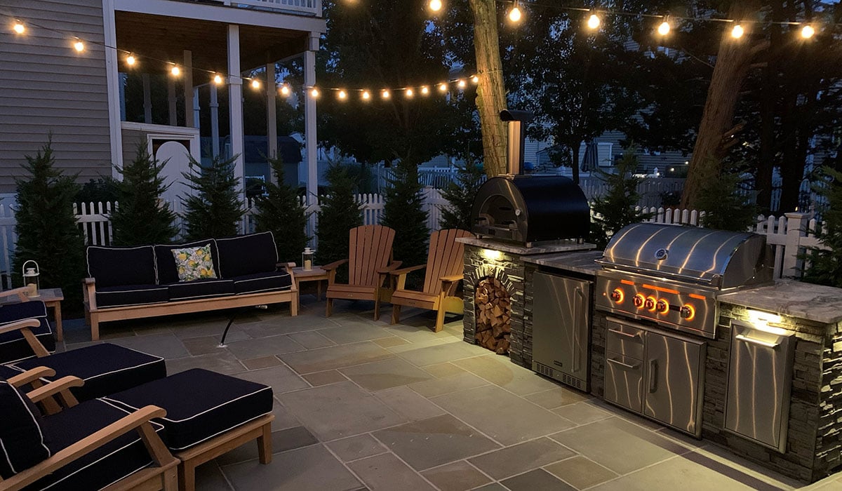 new jersey outdoor kitchen by rta at night with lighting