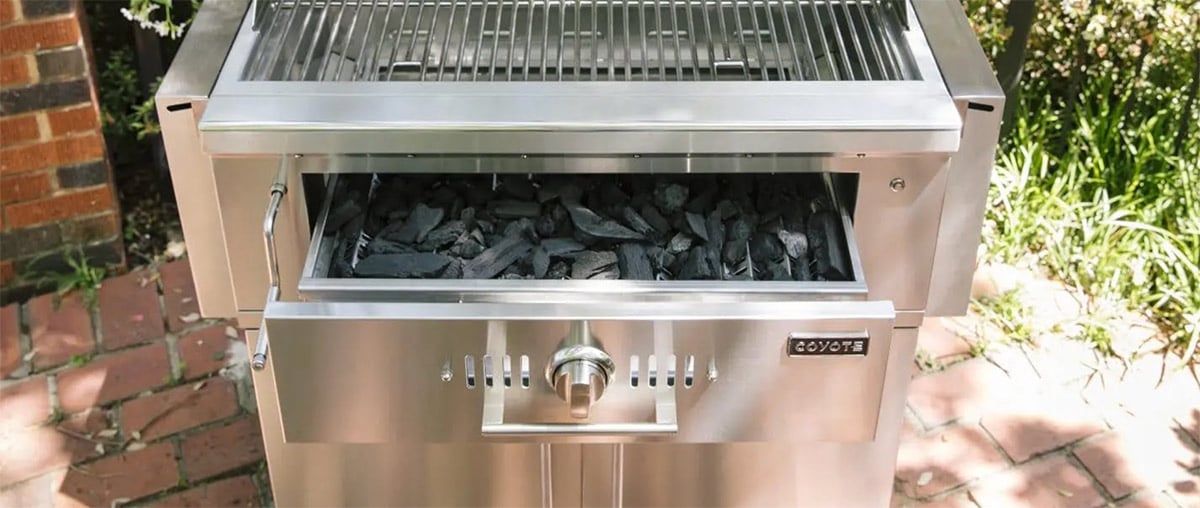 open charcoal tray in grill