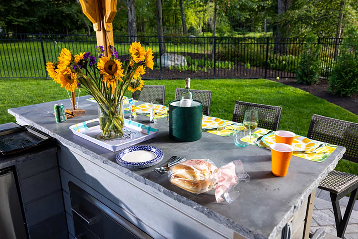 outdoor bar seating with food on counter