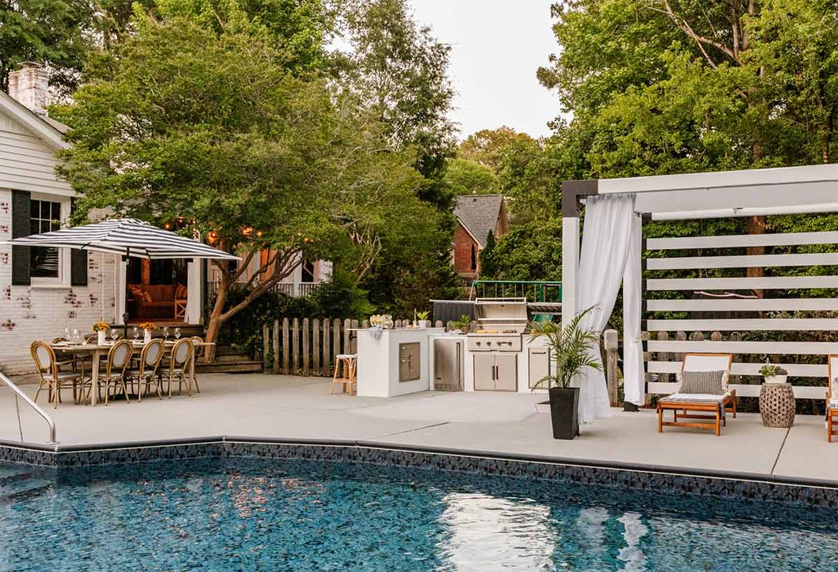 outdoor dining table by pool