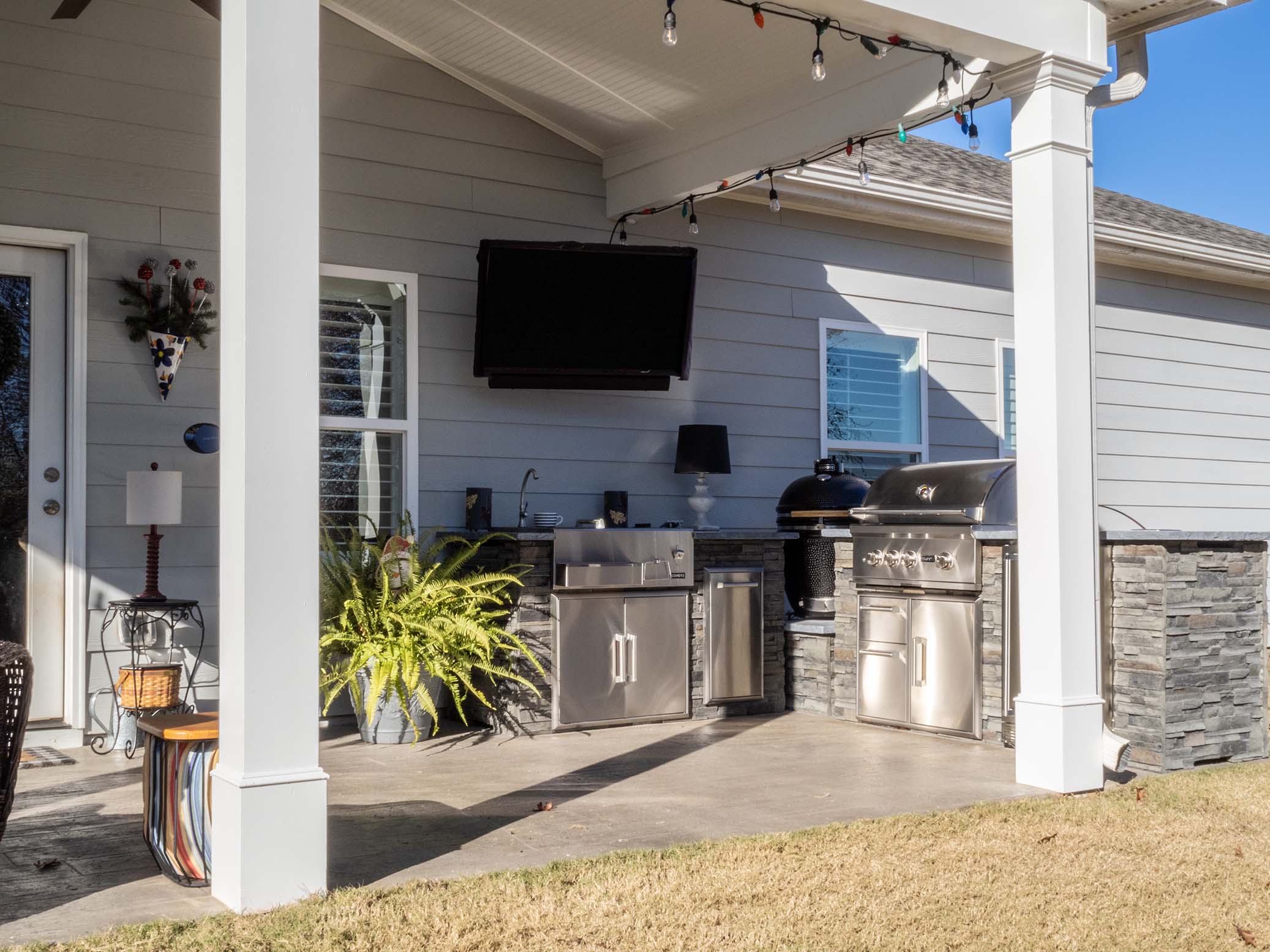 outdoor kitchen built near house