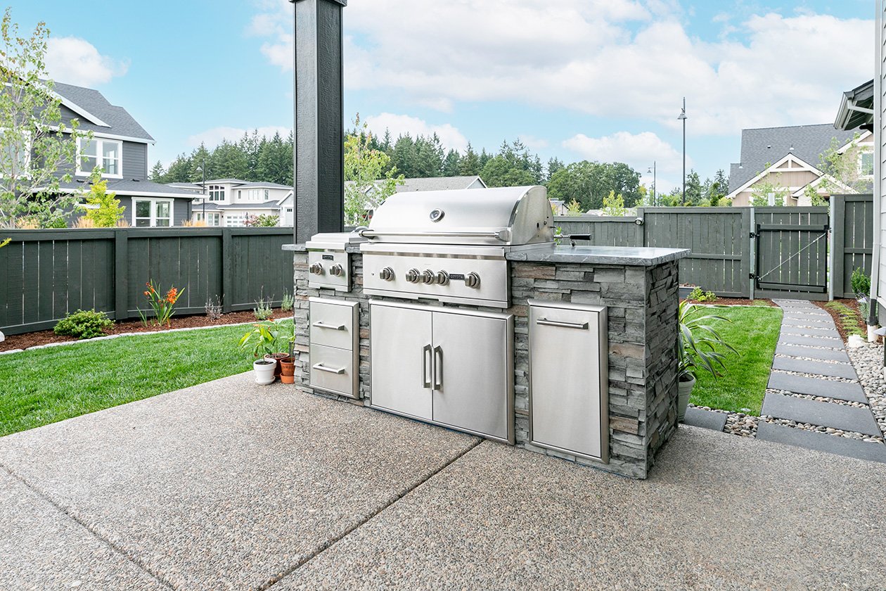 outdoor kitchen grill island with side burner on patio