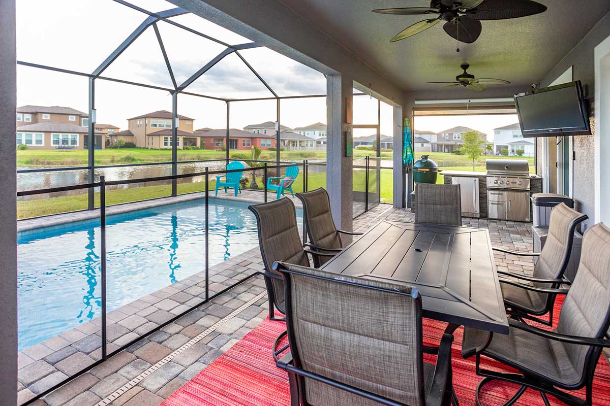 outdoor kitchen in florida room with asado smoker
