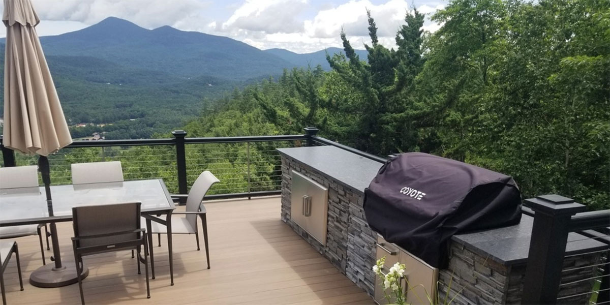 outdoor kitchen on deck with mountain views