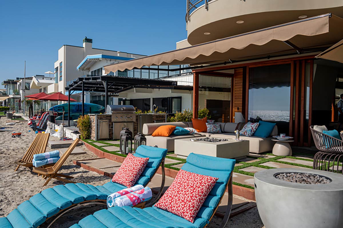 outdoor kitchen on patio right by beach