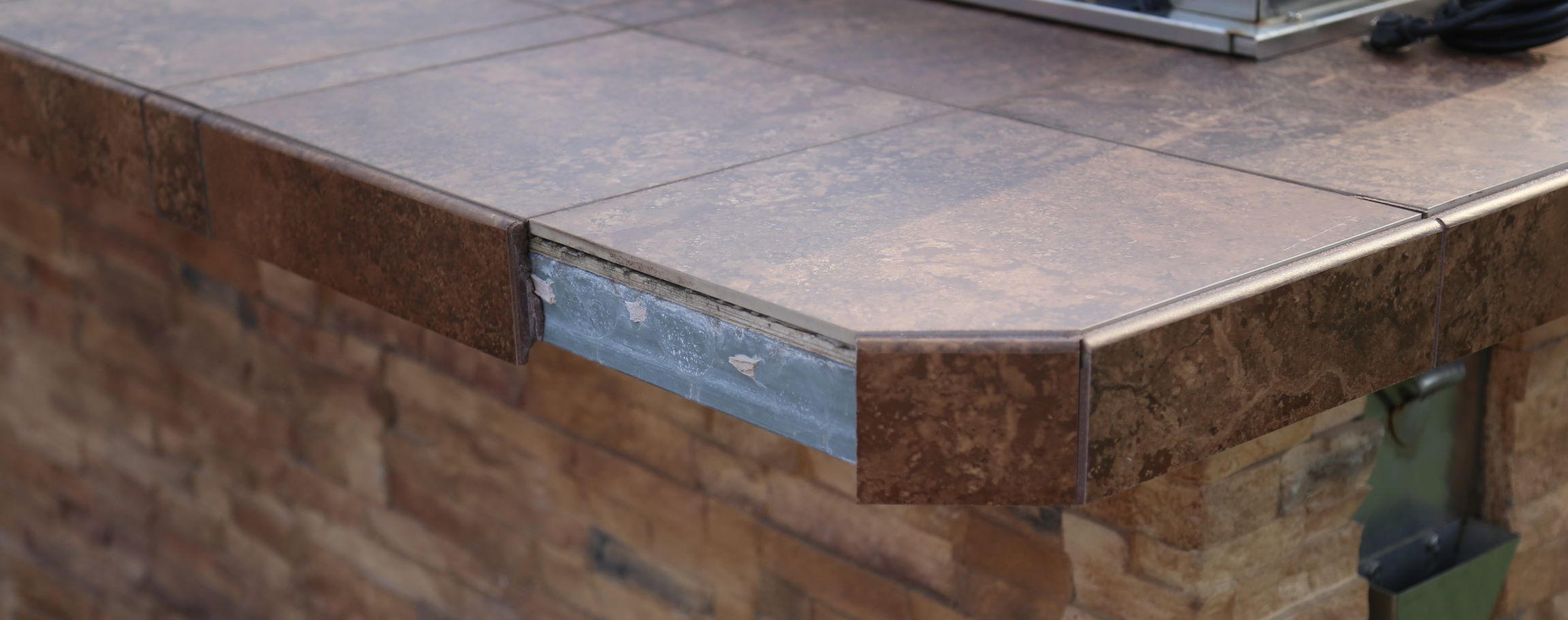 outdoor kitchen tile countertop falling apart