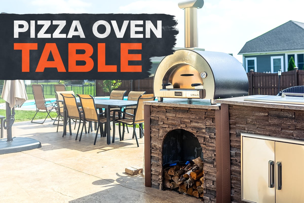 outdoor kitchen with wood fired pizza oven and fridge