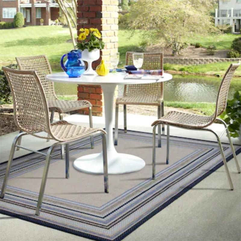 outdoor rug under table and chairs on patio