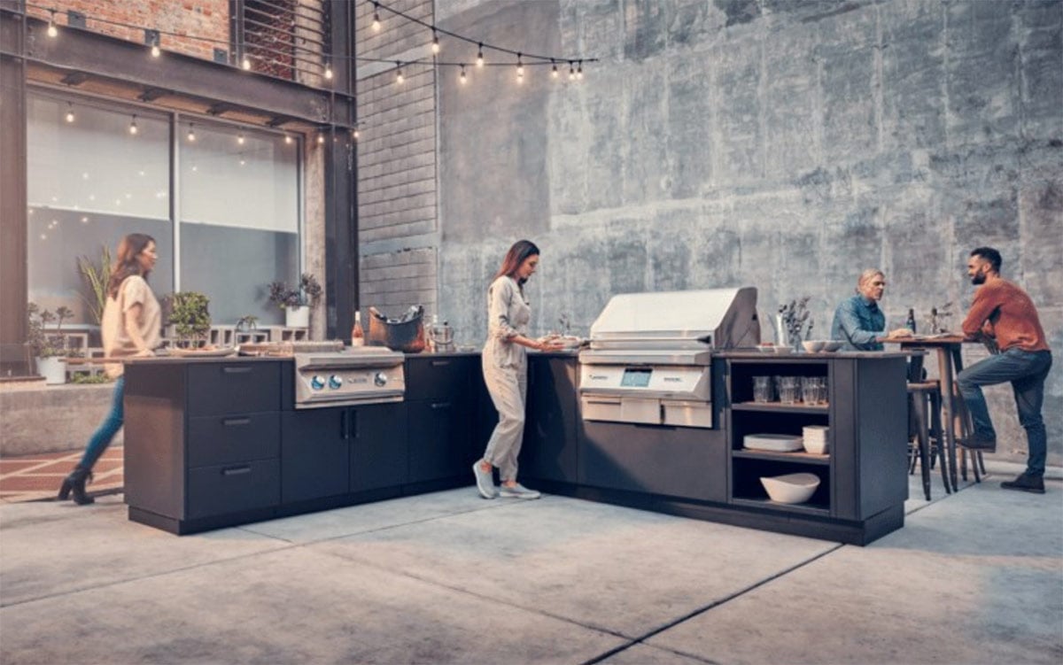 people gathering around an l shaped twin eagles outdoor kitchen