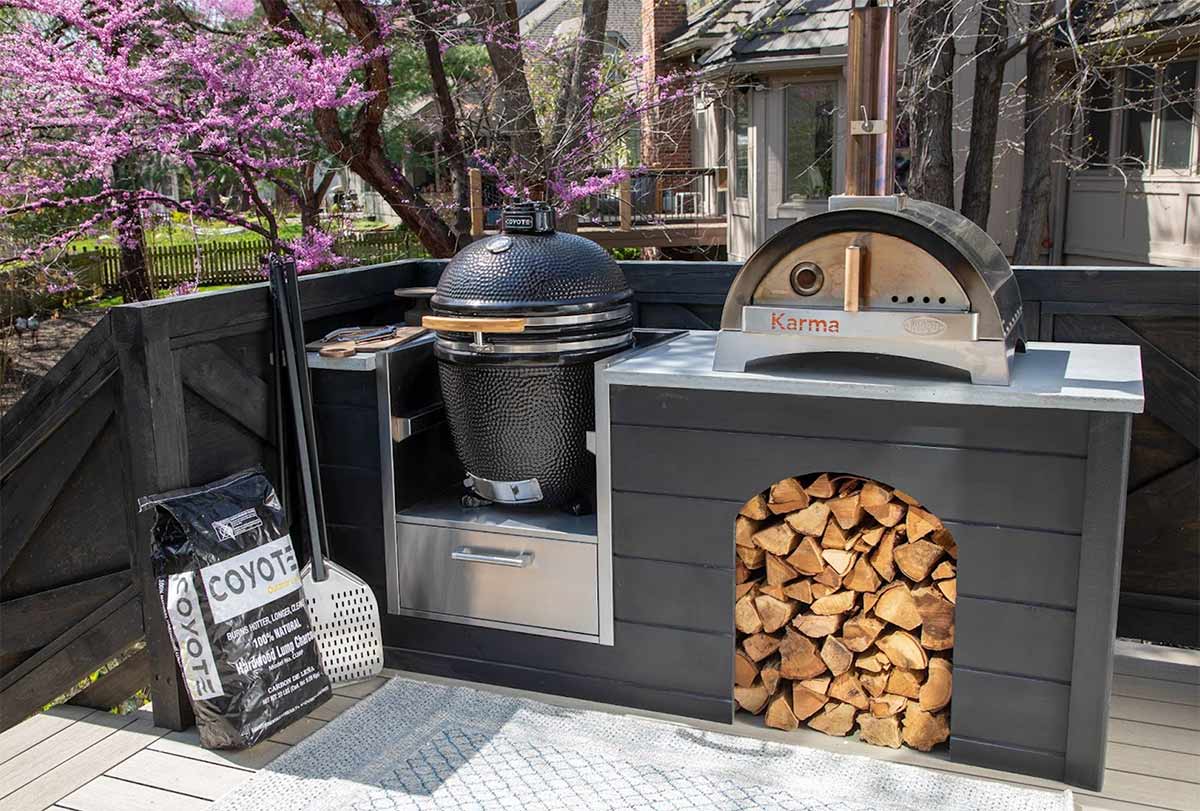 pizza oven and coyote asado stand on deck
