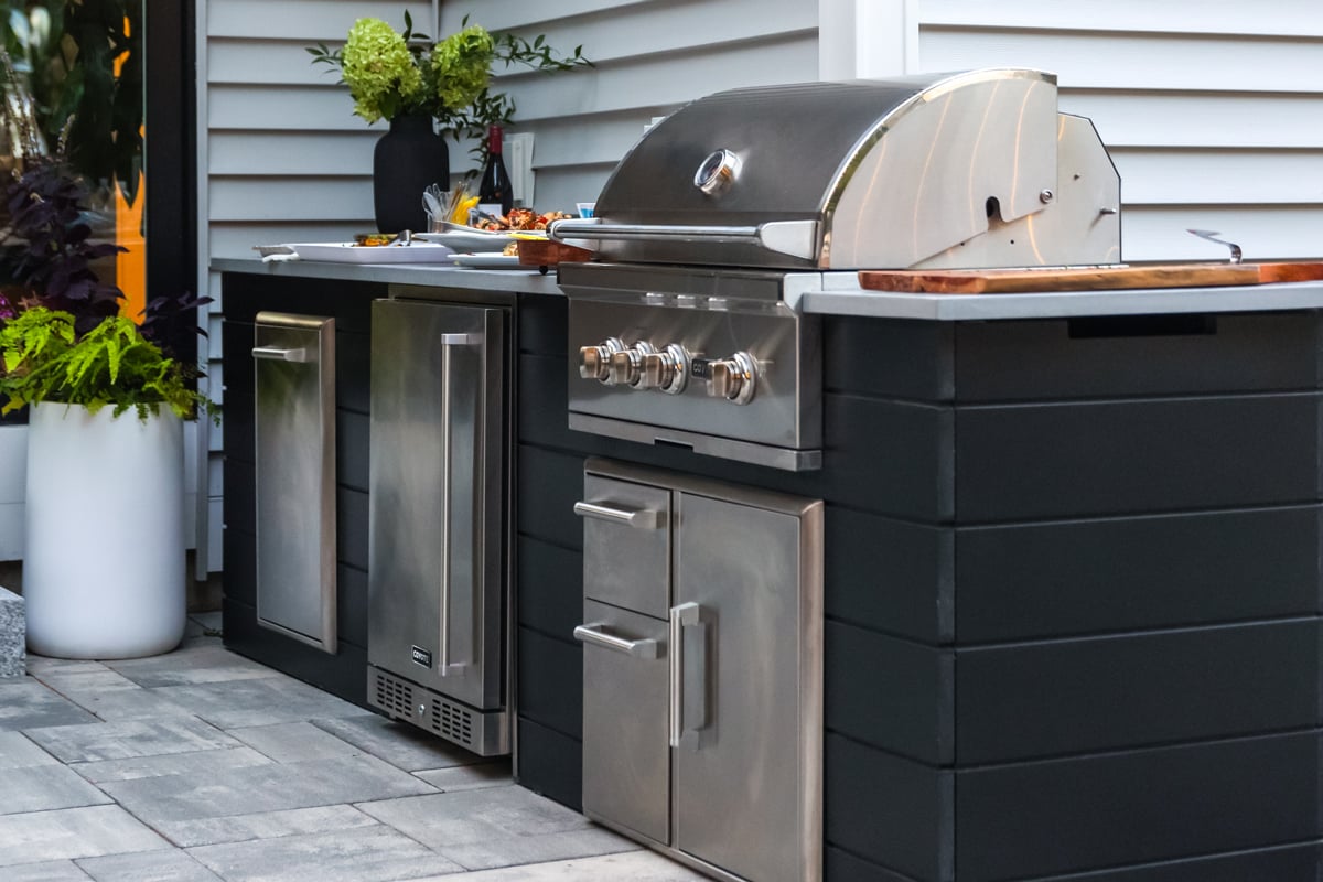 black plank grill island on patio