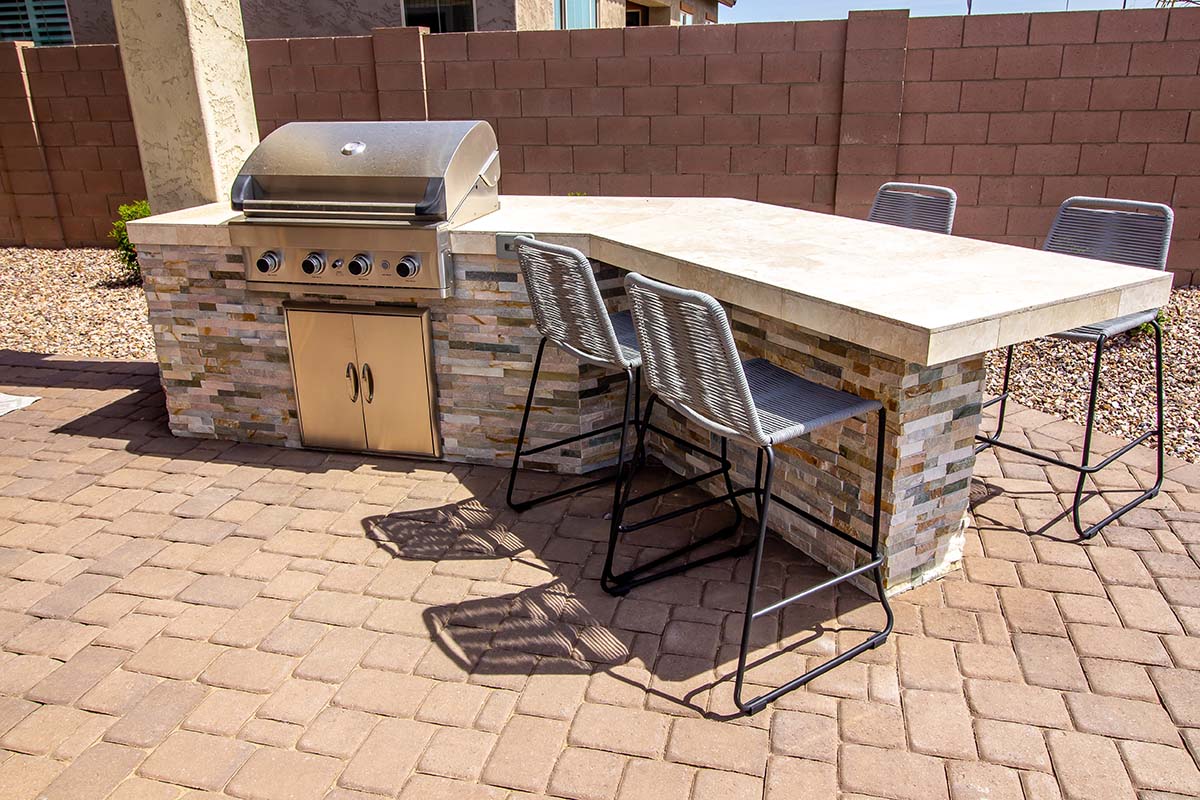 ready to finish or prefab outdoor kitchen with bar seating and built in grilll