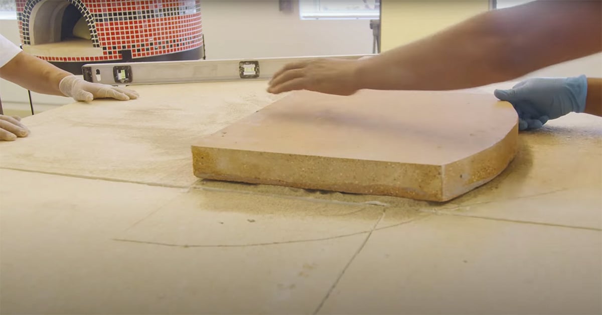preparing the base for the pizza oven