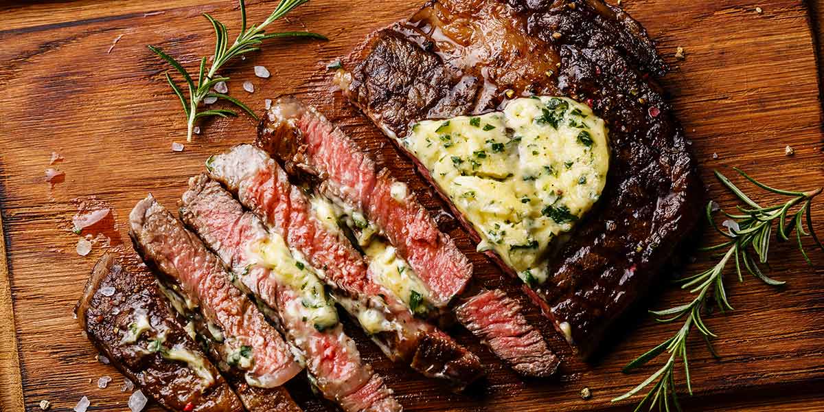 ribeye steak on cutting board
