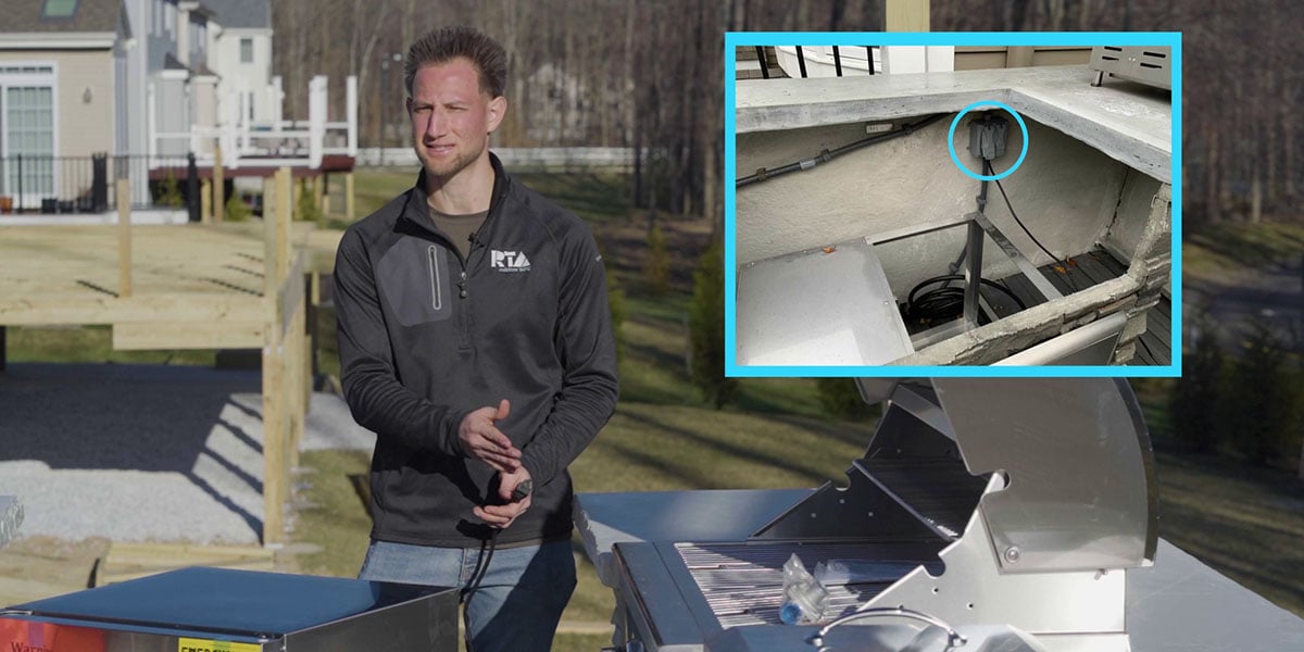 rta employee showing the proper placement of electrical outlet for outdoor fridge