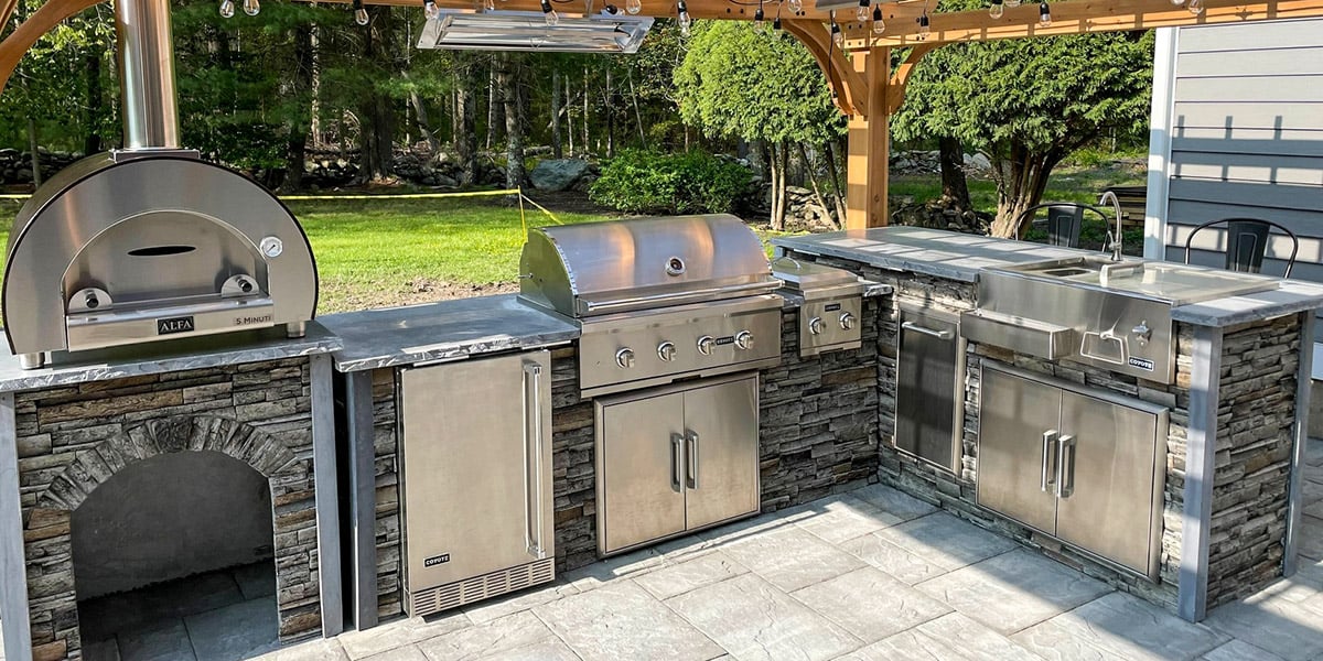 rta outdoor kitchen grill with pizza oven and refreshment center