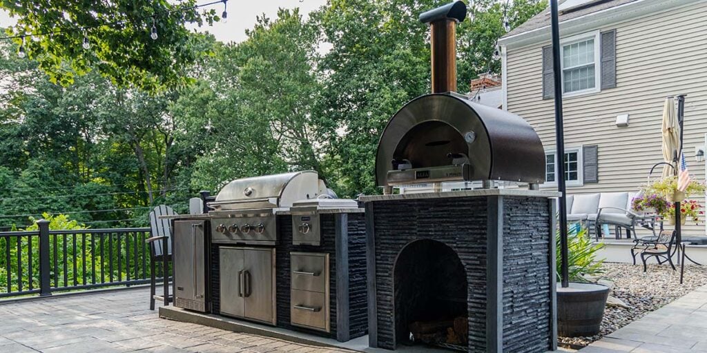 ready to assemble outdoor kitchen with coyote appliances and modern stone ash finish