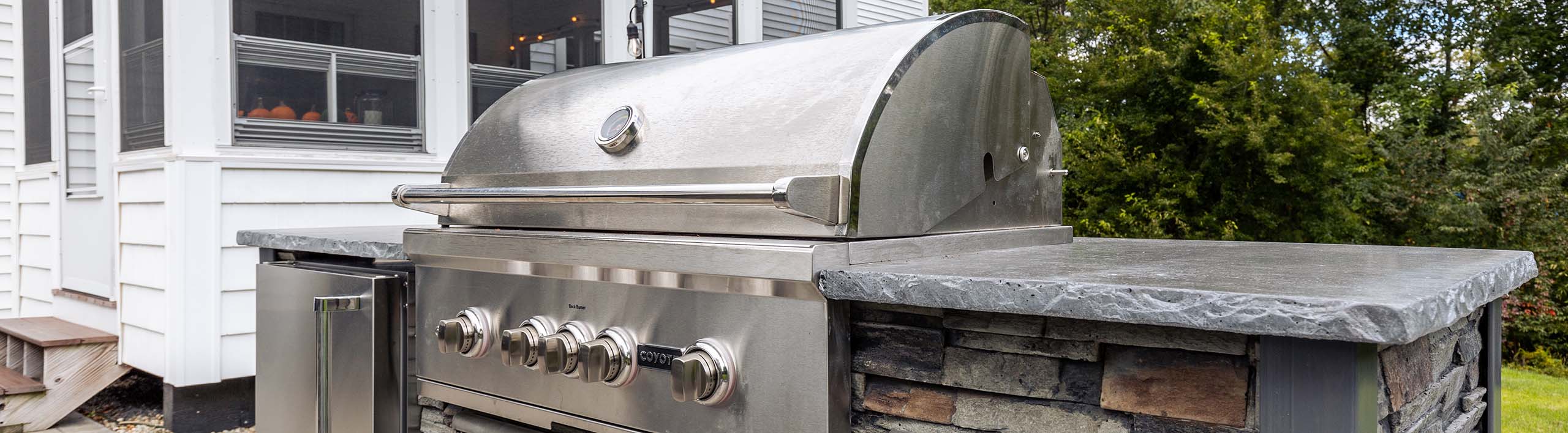 rta outdoor kitchen with s series coyote grill in stacked stone graphite finish