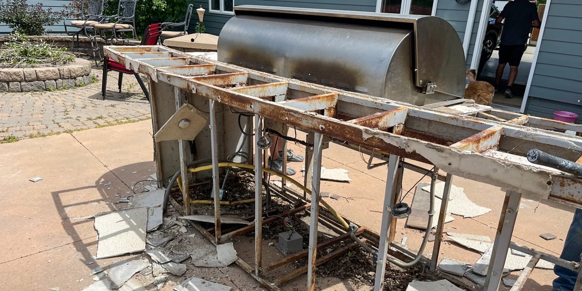 rusted and deteriorated outdoor kitchen frame