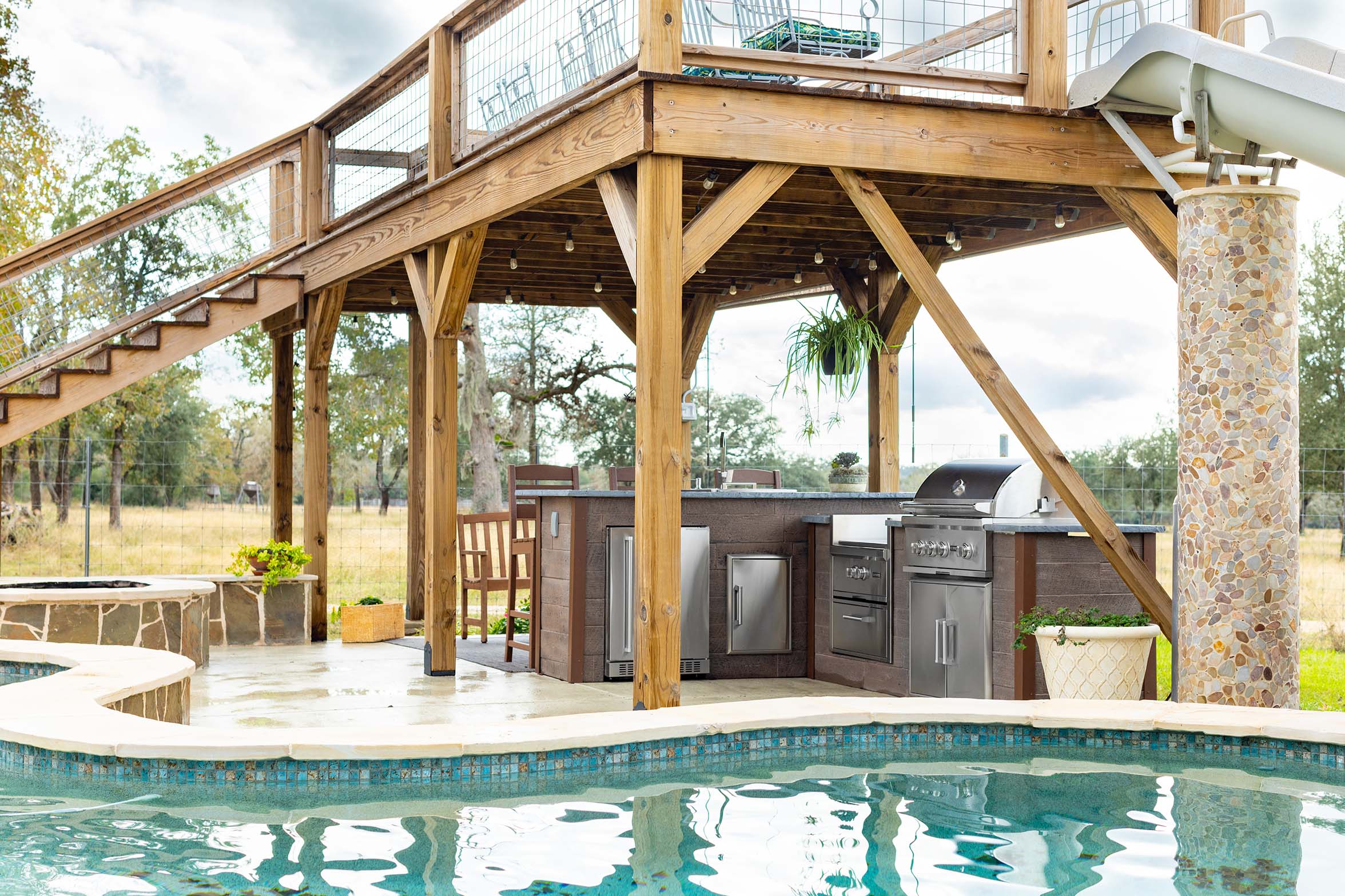 satellite outdoor kitchen next to pool