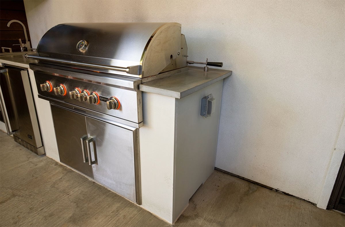 side of outdoor kitchen with outlet